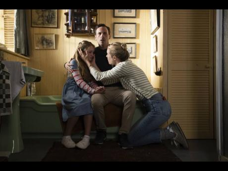This image released by Universal Pictures shows Alix West Lefler (left), Scoot McNairy and Mackenzie Davis in a scene in ‘Speak No Evil’.
