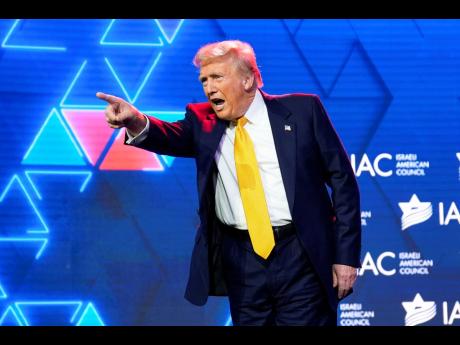 Republican presidential nominee former President Donald Trump acknowledges the crowd after speaking at the Israeli American Council National Summit in Washington on Sepember 19.