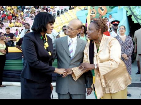2008 FILE PHOTO: Opposition Leader Portia Simpson-Miller (left) chats with Culture Minister Olivia Grange and Hugh Nash, chairman of the Jamaica Cultural Development Commission.