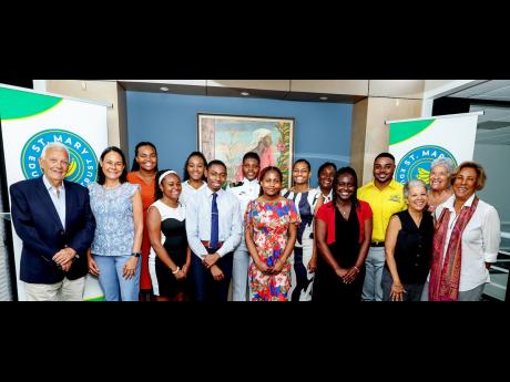 St. Mary Education Trust (SMET) 2024 scholarship recipients alongside SMET directors Charles Johnston (left), trustee of the EJMB and chairman of Jamaica Producers Group; Lisa McGregor-Johnston (second left), chair of SMET and head of corporate services at