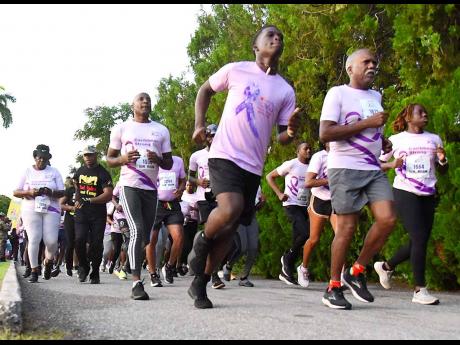 Persons from a range of groups including schools, businesses, clubs and other institutions turned out for the start of the CIBC Caribbean’s Walk for the Cure Run/Walk in the Hope Botanical Gardens early Sunday morning. 