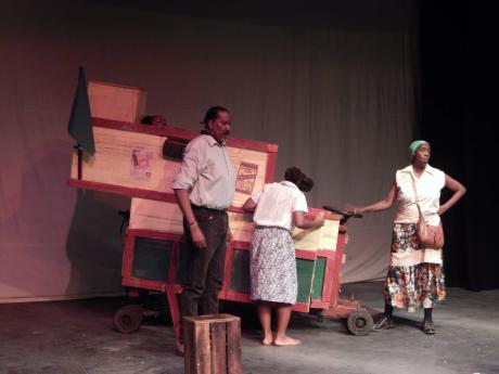 Standing in front of the famous cart in this School of Drama production are (from left) Chaplain (Michael Nicholson), Kattrin (Ajayla Brown) and Madda Courage (Carolyn Allen).