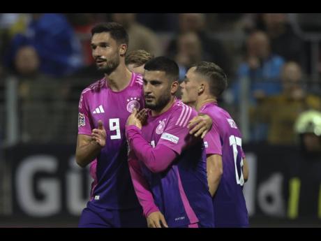 German players celebrate after a goal during the Nations League match between Bosnia and Germany in Zenica, Bosnia and Herzegovina, yesterday.