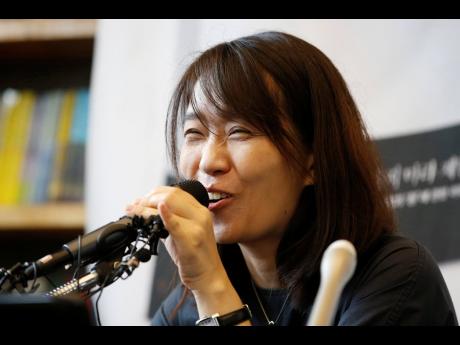 South Korean author Han Kang speaks to the media during a news conference in Seoul, South Korea.
