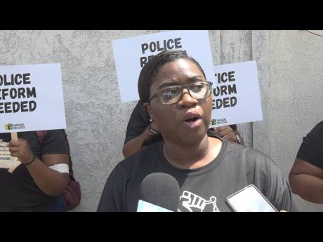 Credit: File
Mickel Jackson, executive director of Jamaicans for Justice, speaking during a protest outside the Barnett Street Police Station in Montego Bay, St James, on August 21, 2024. The protestors called for justice in the death of Mario Deane, who was beaten on