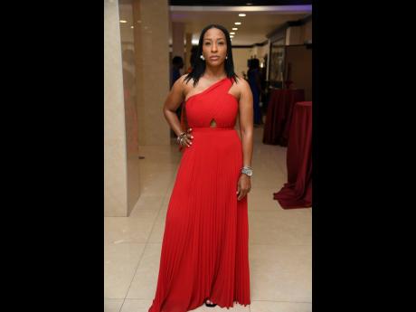 Sherice Norton, director of StudioDuo, commands attention in a red BCBG dress.