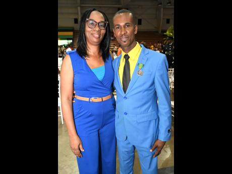 National awardee for the Badge of Honour for Gallantry, Jermaine Hurst and his wife, Dahlia, at the National Honours and Awards Investiture Ceremony held yesterday at the National Indoor Sports Centre in Kingston. 
