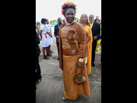Jamaican actress Audrey Reid, who was inducted into the Order of Distinction in the rank of Officer, paired her calabash purse with an African-print dress and bold accessories. 