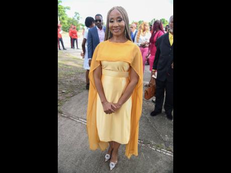 Reggae artiste Nadine Sutherland, who was inducted into the Order of Distinction in the rank of Officer, was styled to ‘ROC’ by Neko ‘Bootleg Rocstar’ Kelly in a golden dress by Steph’s Creations Co. 