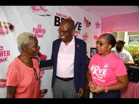 lma Orgill (left), one of the attendees at the JN Group’s free mammogram event, is engaged in conversation with Hugh Reid (centre), general manager of JN Life Insurance Limited and Natalie Henriques (right), marketing officer at JN Life Insurance Limited