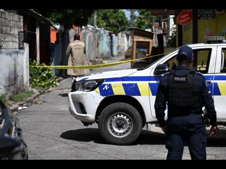 In this July photo, investigators are seen at the scene of a double shooting in Craig Town. Mark Wignall writes: The cold reality is that within the last 20 years, that fantasy that the shooting would play by the rules and keep the mayhem locked away has b