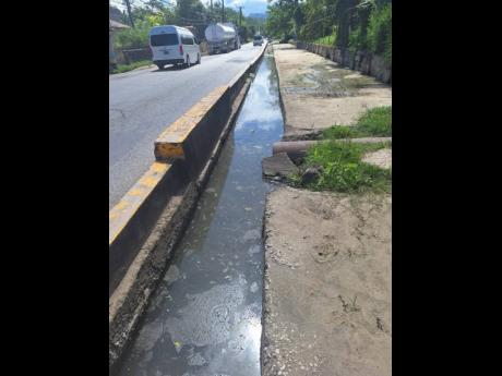 Credit: Photo by Rochelle Clayton Water settles in a drain in Lucea, Hanover, last week.