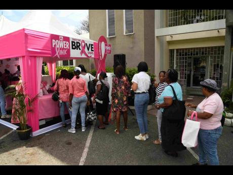 Women line up to sign up for their complimentary mammograms at the JN-sponsored World Mammography Day event held at the Jamaica Cancer Society on October 18.