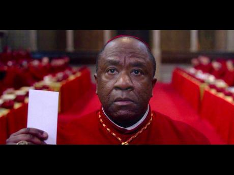 This image released by Focus Features shows Lucian Msamati in a scene from ‘Conclave’. Nigerian Cardinal Joshua Adeyemi, played by Msamati, could be the first black pope, but his homophobic views clash with the progressives.  