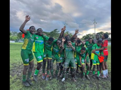 Credit: Ashley Anguin
Ocho Rios High School’s players celebrate a 2-2 draw against Dinthill Technical High School at Drax Hall that put them through to the ISSA/WATA daCosta Cup quarter-finals yesterday.