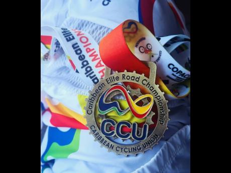 Credit: @llori_the_sharpest Llori Sharpe’s Elite Caribbean Championships gold medal.