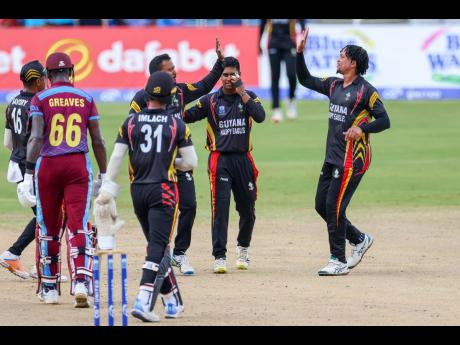 Credit: Courtesy of CWI Media The Guyana Harpy Eagles celebrate with the wicket of Leeward Islands Hurricanes opener Justin Greaves during their CG United Super50 game at the Brian Lara Cricket Academy in Tarouba, Trinidad, on Tuesday.