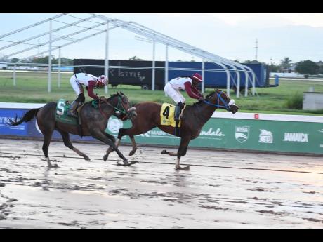FUNCAANDUN (right), with Robert Halledeen aboard, wins the Phillip Feanny O.D. Gold Cup over seven furlongs  at Caymanas Park on Saturday, October 5, 2024.