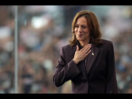 Vice President Kamala Harris gestures as she delivers a concession speech for the 2024 presidential election.
