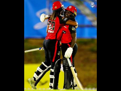Credit: Courtesy of @WBBL Right: West Indies and Melbourne Renegades players Hayley Matthews (left) and Deandra Dottin embrace after a successful Renegades run chase in a Women’s Big Bash League cricket game against the Adelaide Strikers yesterday.