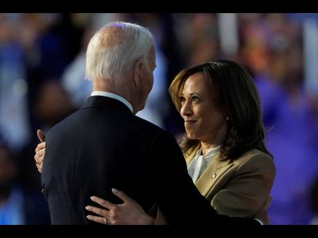 US Vice President Kamala Harris hugs President Joe Biden.