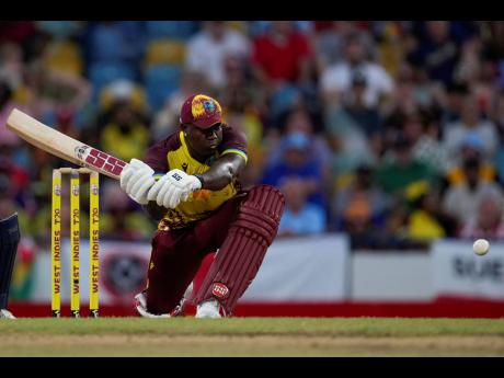 West Indies captain Rovman Powell gets ready to play a sweep shot during the second T20 cricket match against England at Kensington Oval in Bridgetown, Barbados, on Sunday.