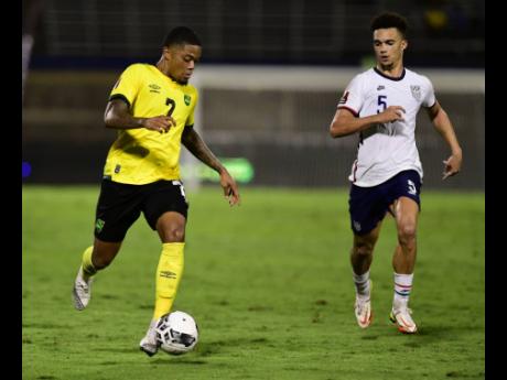 Credit: Gladstone Taylor Jamaica’s Leon Bailey (left) dribbles by the United States’ Antonee Robinson during a Concacaf World Cup qualifier at the National Stadium in 2022.