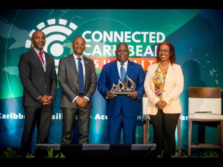 Connected Caribbean Summit conveners pose with Bahamian Prime Minister Philip Davis at the conference in 2023.