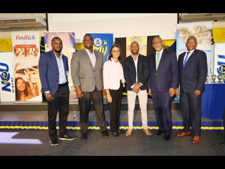 NCU President (right), Dr Lincoln Edwards, joins presenters at the end of the lecture sponsored by the Carnegie Foundation for Cancer Research on November 7. From left are Dr Darrion Walker, Dr Cliff Riley, Beverly Henry (lecture coordinator), Dr Kasey Rei