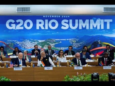 From front left: President Joe Biden, Indian’s Prime Minister Narendra Modi, Brazil’s President Luis Inacio Lula da Silva, South Africa’s President Cyril Ramaphosa and other G20 leaders listen during the G20 Summit at the Museum of Modern Art in Rio 