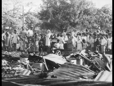 Onlookers gather at the Eventide Home for the Aged in the aftermath of the devastating fire that killed 153 old women on May 20, 1980.
