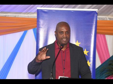 Richard Jones, executive director of the Caribbean Policy Development Centre, addressing the CVSS’s national volunteer conference, recently.
