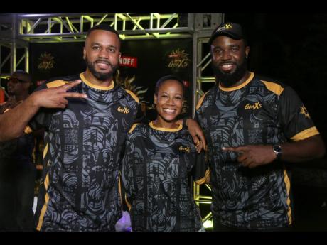 Credit: Nathaniel Stewart GenXS co-directors Matthew Waddell (left) and Kino Johnson (right) flank GenXS model, veterinarian Dr Briana Schwapp Hayle, at the viewing party for the GenXS virtual band launch, held on Friday at The Clubhouse Brewery in St Andrew.