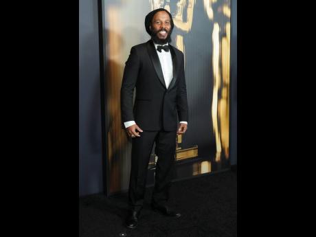 Ziggy Marley suits up for the occasion in a classic tux by Paul Smith.