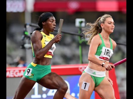 Tovea Jenkins (left) of Jamaica competing in the 4x400-metre mixed relay at the Tokyo 2020 Olympic Games.
