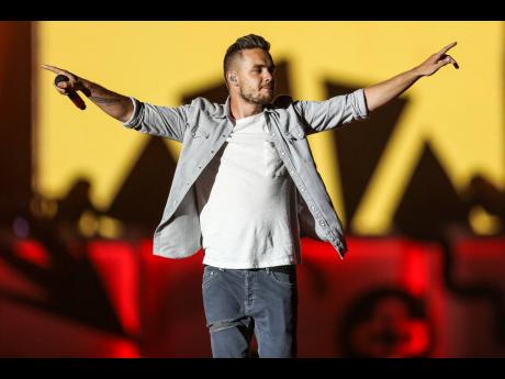 Credit: AP/File In this July 9, 2015 file photo Liam Payne of One Direction performs during the Honda Civic Tour at Qualcomm Stadium in San Diego, California.