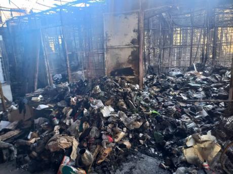 Charred remains of vendor Kay Daniels' goods that were destroyed in the Pearnel Charles Arcade fire.