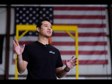 Hector Xu, CEO of Rotor Technologies, gestures during an interview at the company’s hanger where unmanned semi-autonomous helicopters are being assembled on November 11.