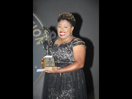 The Gleaner’s photographer, Ashley Anguin, who won the Aston Rhoden Award for News Photography.