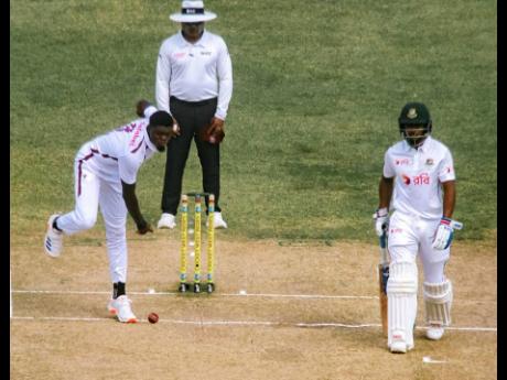 Credit: Photo Courtesy of CWI West Indies pacer Alzarri Joseph (left) bowls on the third day of the First Test against Bangladesh in Antigua yesterday.