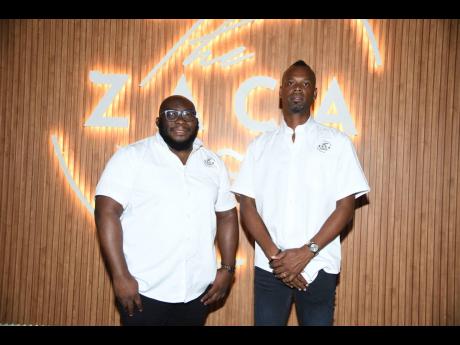 The Zacca’s development and marketing manager, Damion Green (left), celebrates the successful launch of the culinary oasis with Deino Campbell, the managing director.