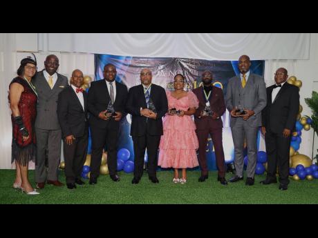 From left: Beverly Henry, retired NCU administrator; Harold Clayton, president of the NCU Alumni Federation International; Danieto Murray, NCU director of alumni relations, advancement and development; Donmayne Gyles, awardee; Omar Fennel,awardee; Basillia