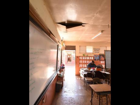 Credit: Ian Allen/Photographer The damaged ceiling in one of the classrooms at Grove Town Primary and Infant School in Manchester. Every block at the school leaks whenever it rains.