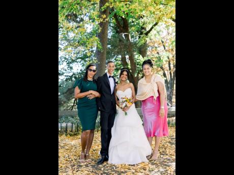 The bride and groom, with his mother, Marie Dobson-Dixon (left), and sister, Tranique Dixon.