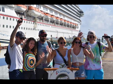 Passengers arrive on the ‘Carnival Sunrise’ – the first cruise vessel to visit Jamaica following the resumption of cruise tourism – at the Ocho Rios Cruise Terminal in St Ann on August 16, 2021. 
