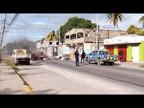 The scene of yesterday’s protest on Bobby Lane in St Catherine. 