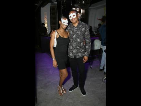 Brittany Williams opts for a classic little black dress, while Dr Kevin Walker presents a patterned look to complement the dark colour theme.