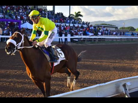 ROUGH ENTRY, ridden by Julien Leparoux, wins the second running of the lucrative Moutett Mile at Caymanas Park on Saturday, December 2, 2023.