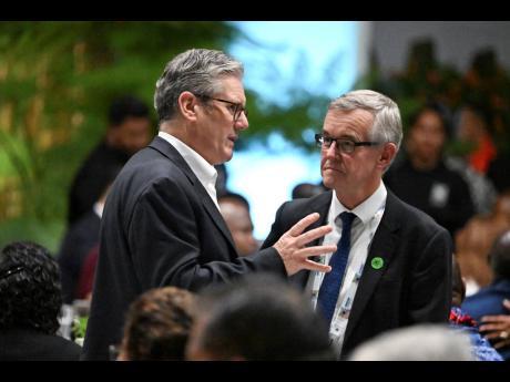 British Prime Minister Keir Starmer, left, attends a State Banquet during the Commonwealth Heads of Government Meeting (CHOGM) in Apia, Samoa in October.