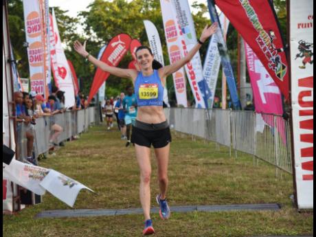 Credit: Ashley Anguin England’s Rosamund Ponder taking the women’s half marathon in 1:32:01 at the 24th Reggae Marathon in Negril, Westmoreland, yesterday.